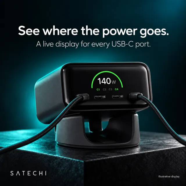 Ad for the Satechi ChargeView 140W Desktop Charger. The black charger on a dark plinth in teal light, with two braided cables plugged in and a screen reading 140W with ports C1 and C4 highlighted. Text: 'See where the power goes. A live display for every USB-C port.' Small print: 'Illustrative display'.